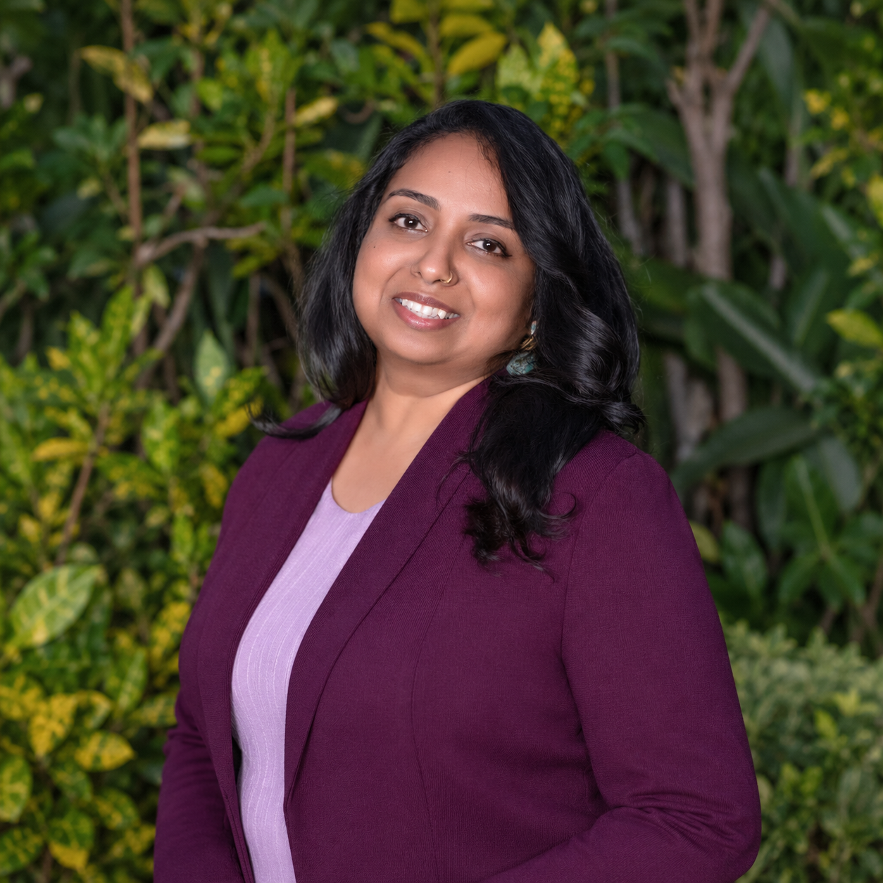 Professional portrait of Panchami Santhosh wearing a purple jacket