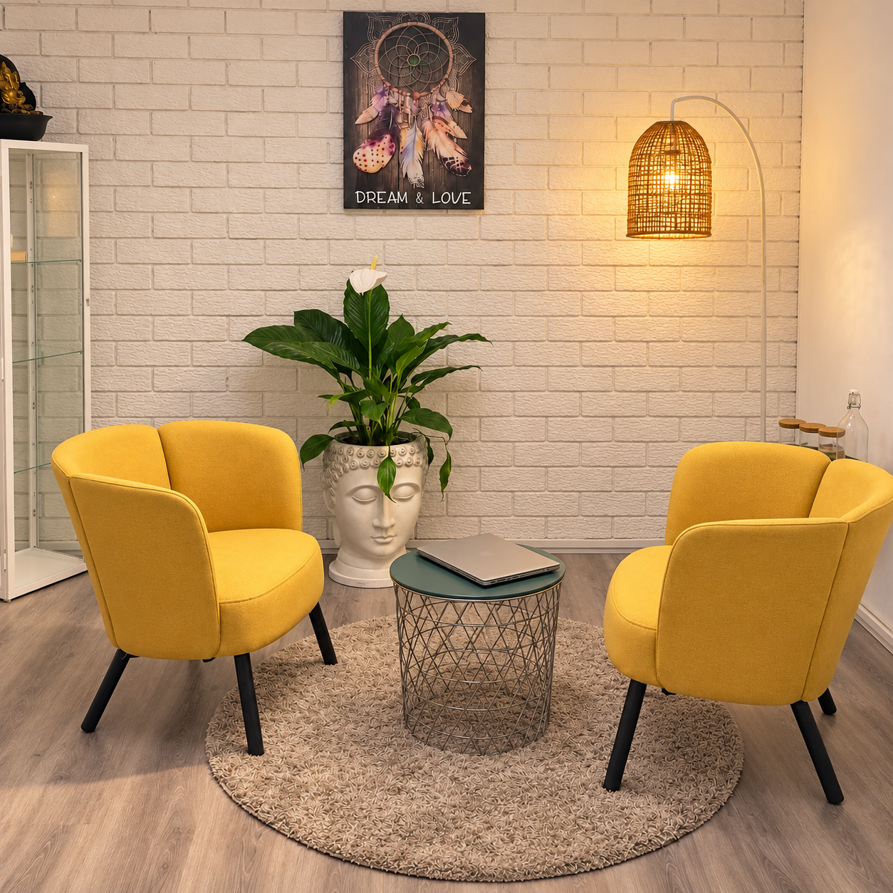 The two yellow counselling chairs in the warmly lit ohM Therapy practice room